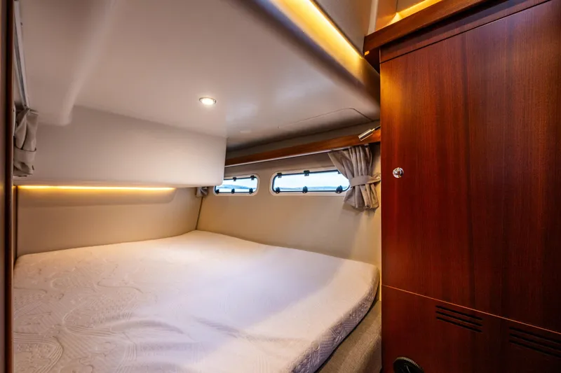 Slide: The Image of Luxurious cabin interior of 2023 Nimbus 405 Coupé with cozy bed and wooden accents. - 42