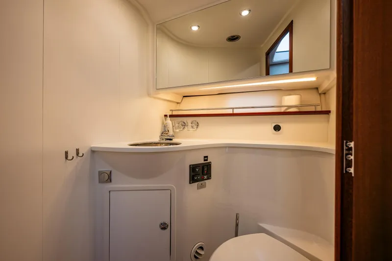 Slide: The Image of Luxurious bathroom interior of 2023 Nimbus 405 Coupé yacht, featuring modern fixtures and lighting. - 44