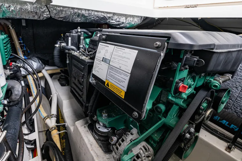 Slide: The Image of Engine compartment of 2023 Nimbus 405 Coupé, featuring Volvo Penta components and detailed wiring. - 49