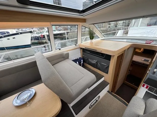 Slide: The Image of 2023 Nimbus 405 Coupé yacht named "Crazy Love" docked, featuring sleek design and modern amenities. - 8