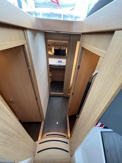 Slide: The Image of Interior hallway of 2023 Nimbus 405 Coupé #124 yacht with wooden finish. - 31