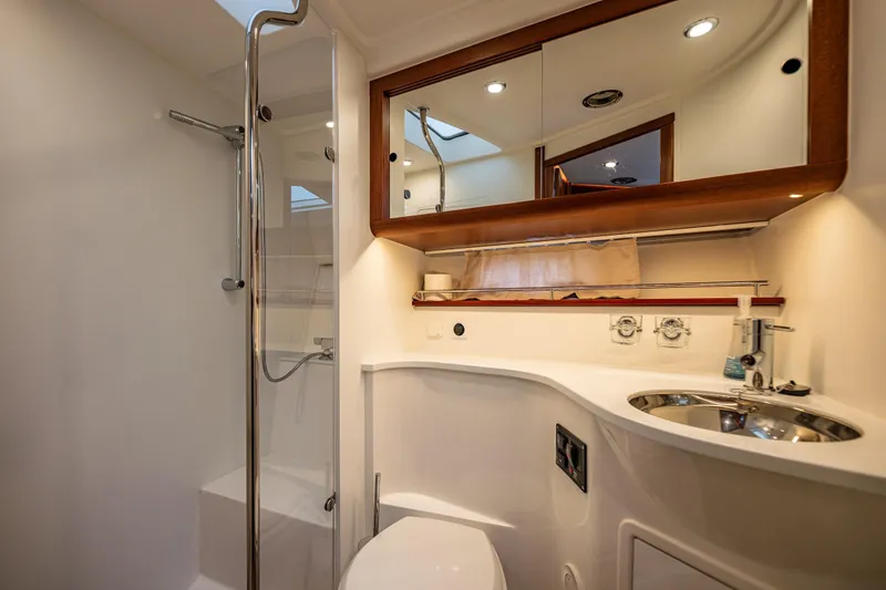 Slide: The Image of Luxurious bathroom in 2023 Nimbus 405 Coupé yacht with modern fixtures and elegant design. - 46