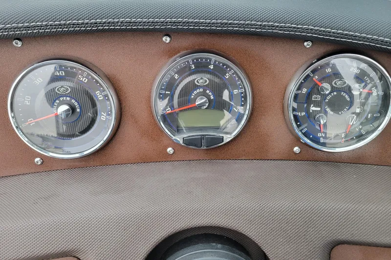Slide: The Image of Dashboard of a 2016 Cobalt CS3 boat with speedometer, tachometer, and gauges. - 15