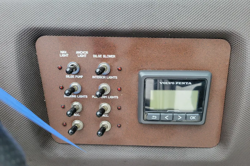 Slide: The Image of Control panel of a 2016 Cobalt CS3 boat with switches and Volvo Penta display. - 16