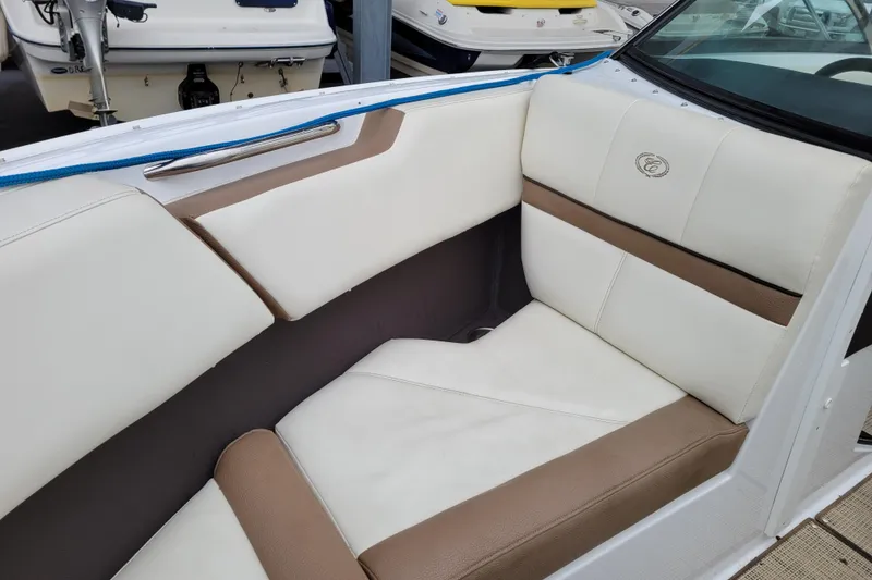 Slide: The Image of 2016 Cobalt CS3 boat interior with white and brown seating. - 21