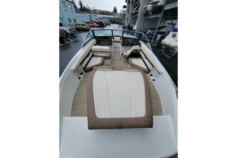 Slide: The Image of 2016 Cobalt CS3 boat interior with beige seating and modern dashboard. - 6