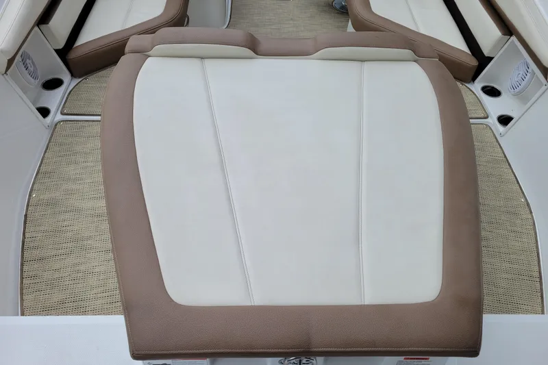 Slide: The Image of 2016 Cobalt CS3 boat interior with beige and white cushioned seating. - 7