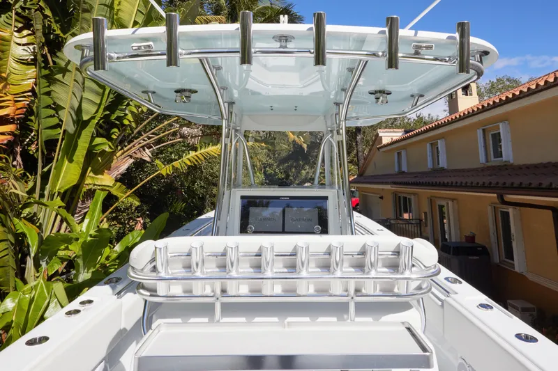 Slide: The Image of 2024 Contender 35 ST boat with sleek design, rod holders, and advanced navigation system. - 16