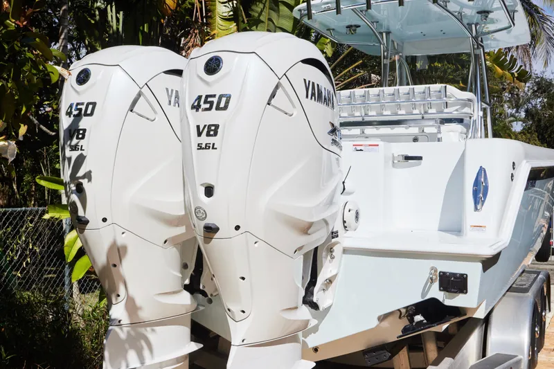 Slide: The Image of 2024 Contender 35 ST boat with dual Yamaha 450 V8 engines, rear view. - 4