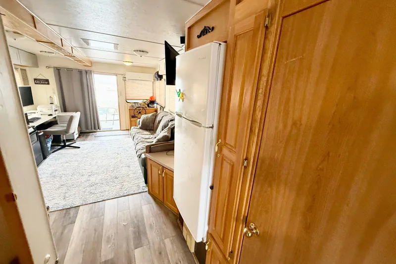 Slide: The Image of Interior of 2006 Myacht 4313 houseboat with cozy living area and modern amenities. - 11