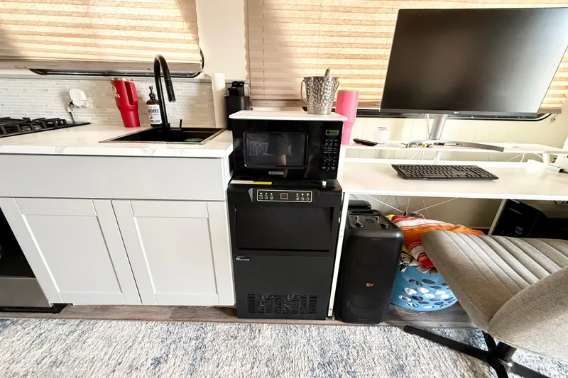 Slide: The Image of Modern Myacht 4313 interior with kitchen, microwave, and workspace, 2006 model. - 6