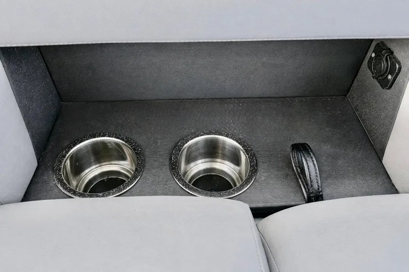 Slide: The Image of Cup holders and storage compartment in 2019 Crest 250 LUSD boat interior. - 11