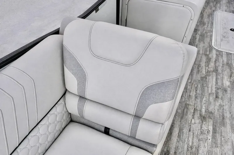 Slide: The Image of Luxurious seating in a 2019 Crest 250 LUSD boat, featuring elegant upholstery and modern design. - 15