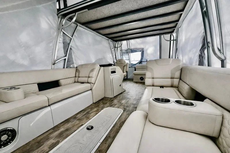 Slide: The Image of Luxurious interior of 2019 Crest 250 LUSD pontoon boat with plush seating and cup holders. - 2