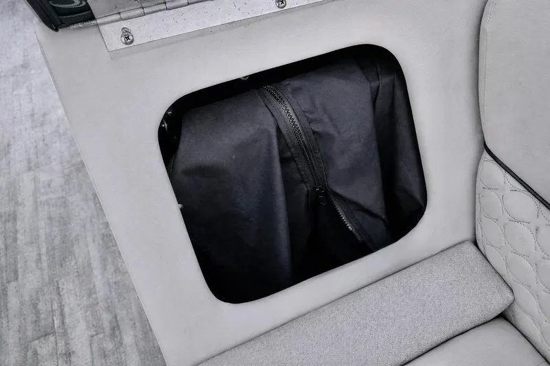Slide: The Image of Storage compartment in 2019 Crest 250 LUSD boat with zippered bag inside. - 30
