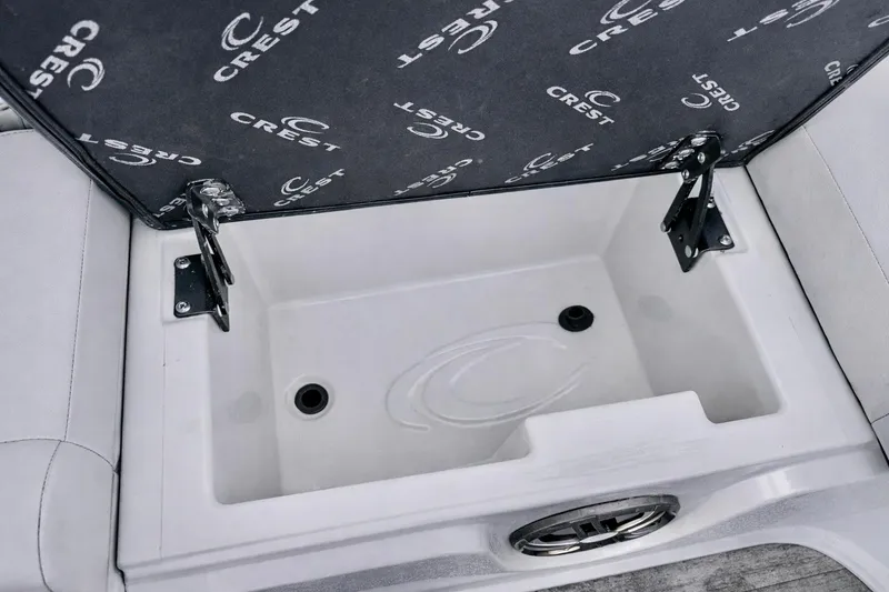 Slide: The Image of 2019 Crest 250 LUSD boat storage compartment with branded cushion cover. - 35