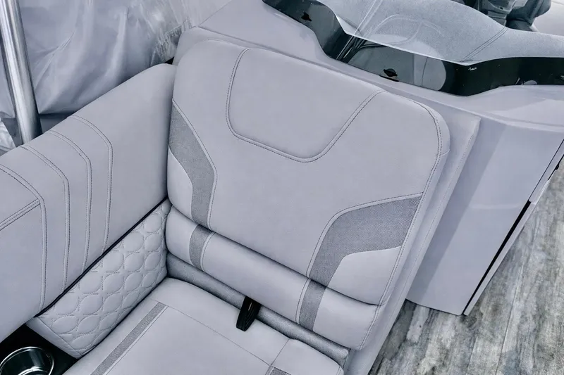 Slide: The Image of Luxurious seating in a 2019 Crest 250 LUSD boat, featuring elegant gray upholstery. - 42