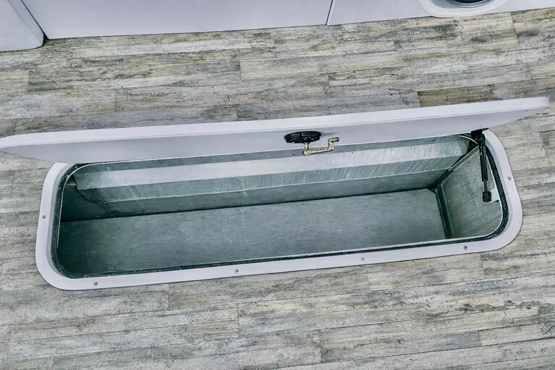 Slide: The Image of Open storage compartment on 2019 Crest 250 LUSD boat, showcasing interior space. - 46
