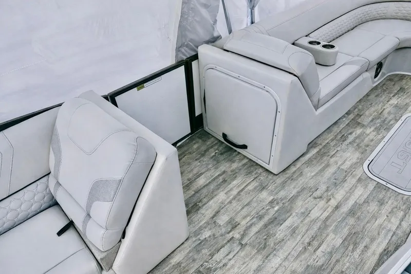 Slide: The Image of 2019 Crest 250 LUSD boat interior with plush seating and wood-style flooring. - 49