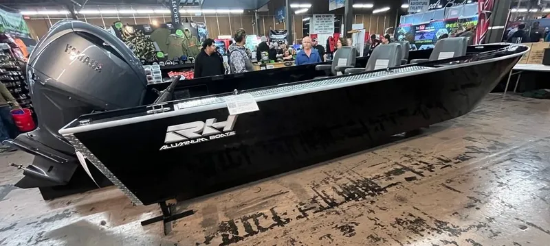 Slide: The Image of RH Boats 23 Commander 2026 displayed at a trade show. - 3