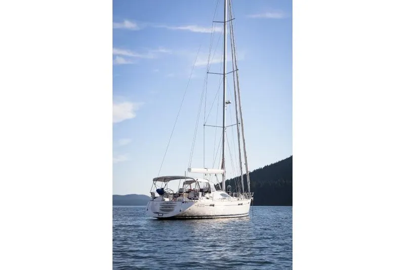 Slide: The Image of 2007 Jeanneau Sun Odyssey 54 DS sailboat on calm water under blue sky. - 12