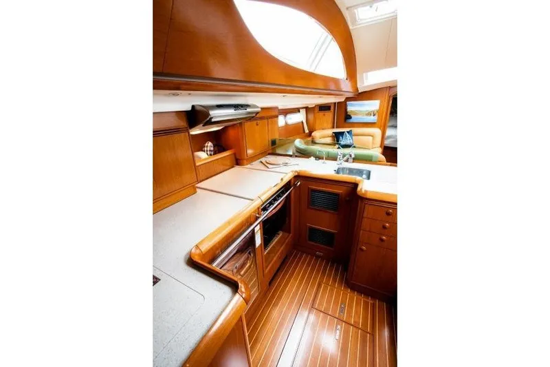 Slide: The Image of Luxurious interior of 2007 Jeanneau Sun Odyssey 54 DS yacht with wooden finishes. - 2