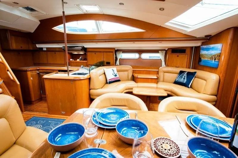 Slide: The Image of Luxurious interior of 2007 Jeanneau Sun Odyssey 54 DS yacht with elegant dining setup. - 3