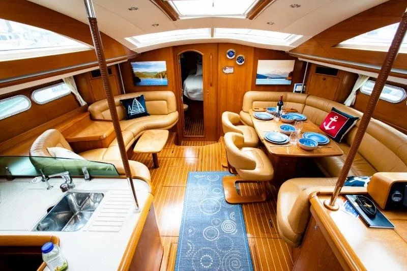 Slide: The Image of Luxurious interior of 2007 Jeanneau Sun Odyssey 54 DS yacht with elegant dining area. - 8