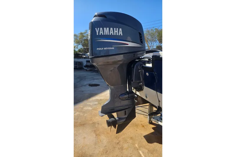 Slide: The Image of Yamaha four-stroke outboard motor on 2009 Cobia 191 Bay boat. - 11