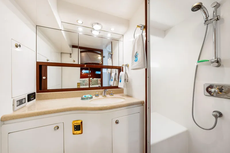 Slide: The Image of Luxurious bathroom in 2007 Hampton 558 Pilothouse yacht with modern fixtures and elegant design. - 35