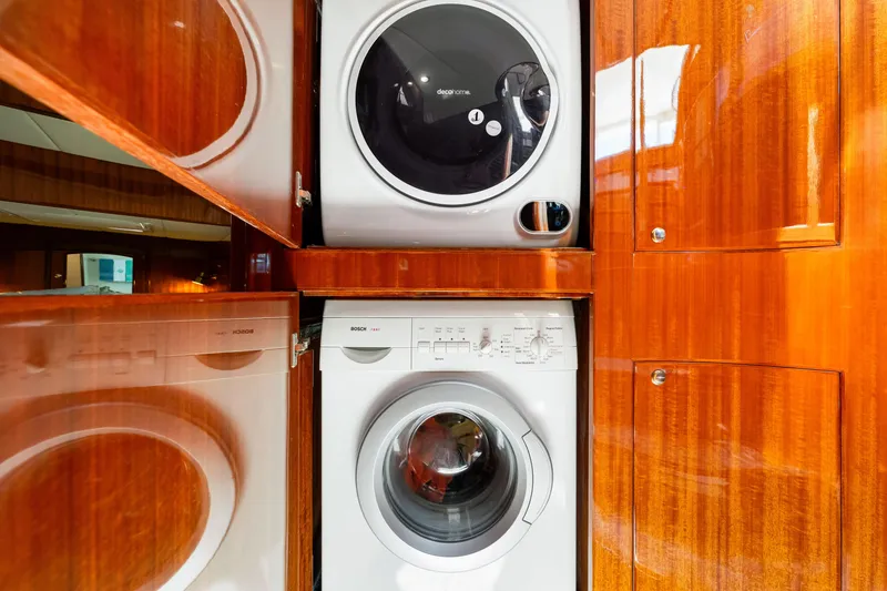 Slide: The Image of Laundry area with washer and dryer in 2007 Hampton 558 Pilothouse yacht. - 40