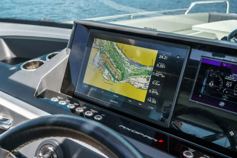 Slide: The Image of Navigation system on 2019 Axopar 28 CABIN boat dashboard, displaying a detailed map. - 25
