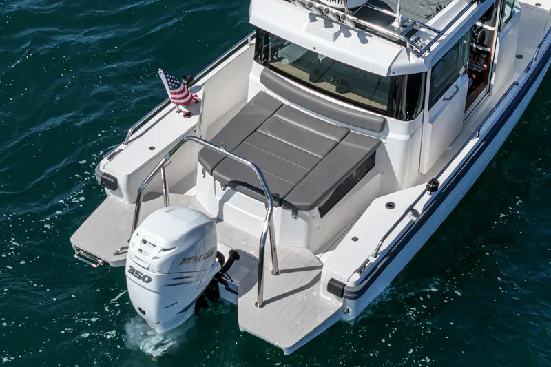 Slide: The Image of Axopar 28 CABIN 2019 boat with Mercury 350 engine on blue water. - 36