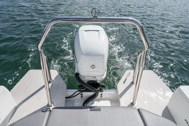 Slide: The Image of 2019 Axopar 28 CABIN boat with outboard motor on water. - 39