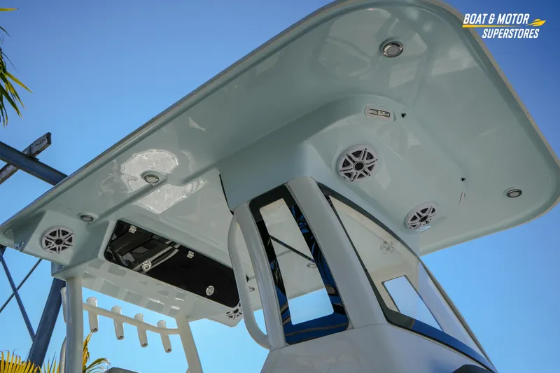 Slide: The Image of 2026 Key West 260 Center Console boat with speakers and canopy, viewed from below. - 11