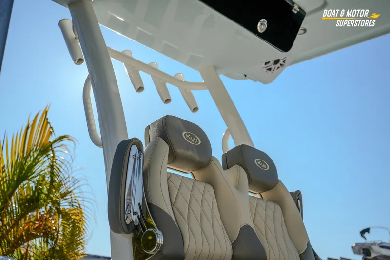 Slide: The Image of 2026 Key West 260 Center Console boat seats under clear blue sky. - 12