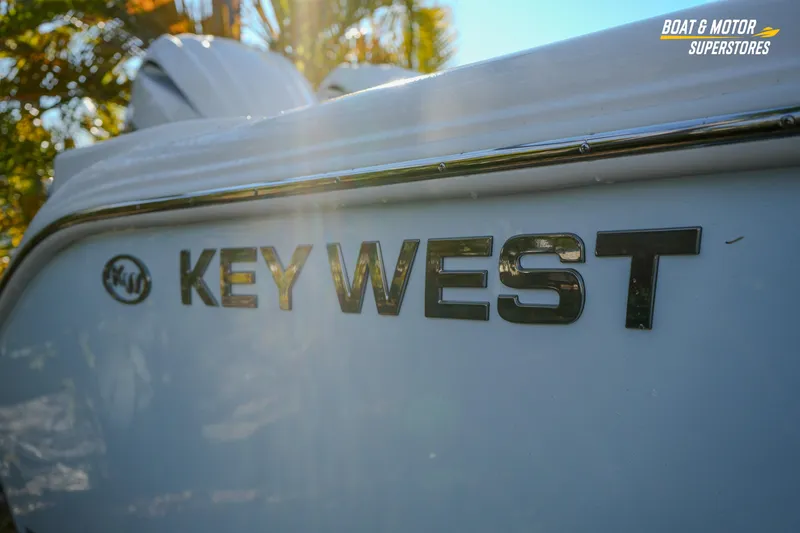 Slide: The Image of 2026 Key West 260 Center Console boat with sunlight reflecting on the logo. - 15