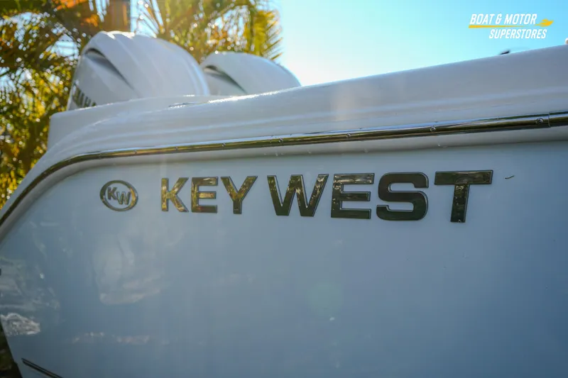 Slide: The Image of 2026 Key West 260 Center Console boat with logo in sunlight. - 16