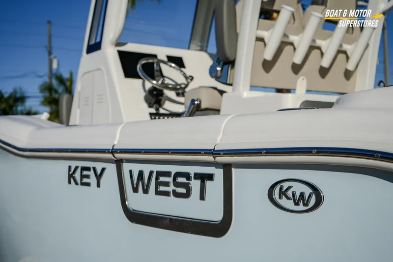 Slide: The Image of 2026 Key West 260 Center Console boat, featuring sleek design and modern steering console. - 26