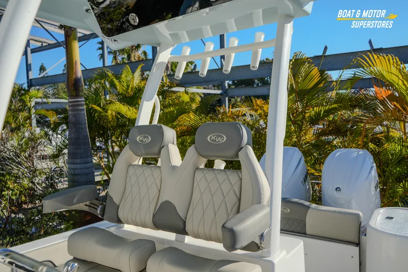 Slide: The Image of 2026 Key West 260 Center Console boat seats with tropical background. - 43
