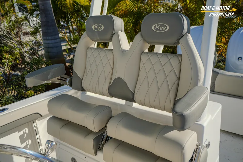Slide: The Image of 2026 Key West 260 Center Console boat seats with diamond stitching and armrests. - 45