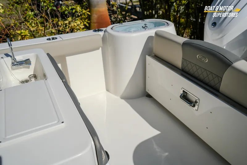 Slide: The Image of 2026 Key West 260 Center Console boat interior with seating and storage features. - 48