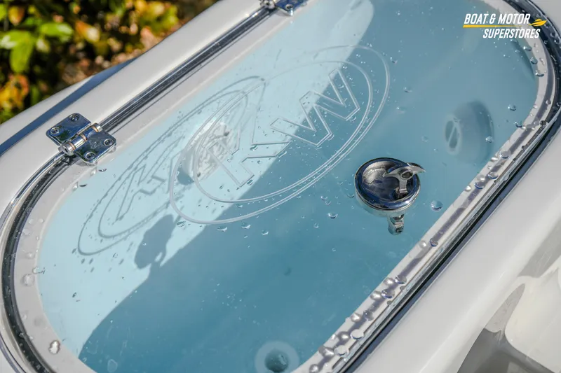 Slide: The Image of 2026 Key West 260 Center Console livewell with water droplets and logo detail. - 50