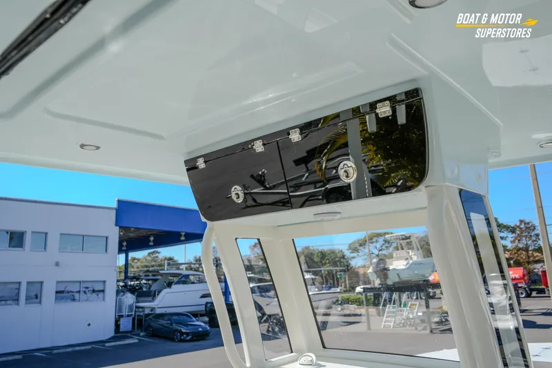 Slide: The Image of 2026 Key West 260 Center Console boat interior with storage compartment at dealership. - 53