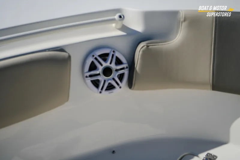 Slide: The Image of 2026 Key West 260 Center Console boat interior with speaker and cushioned seating. - 56