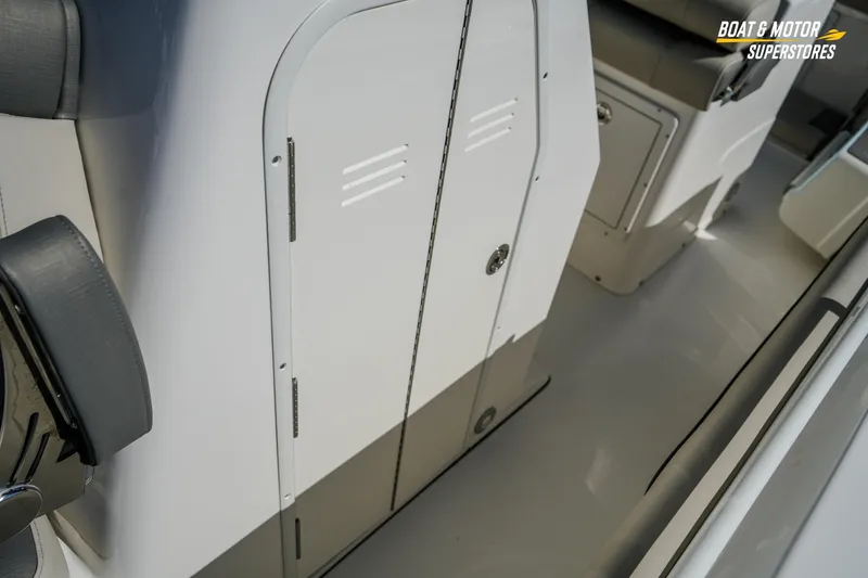 Slide: The Image of 2026 Key West 260 Center Console interior with storage compartment and seating. - 60