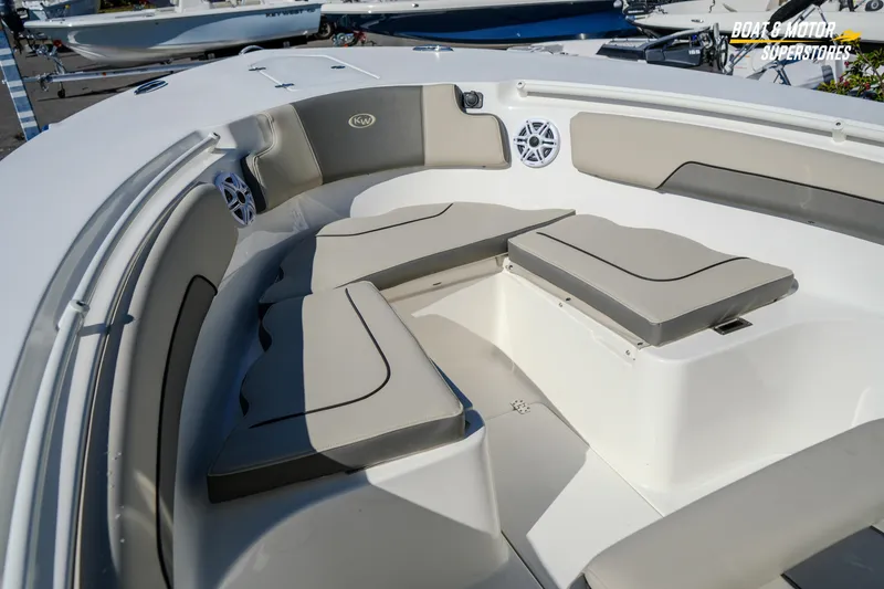 Slide: The Image of 2026 Key West 260 Center Console boat interior with cushioned seating and speakers. - 63