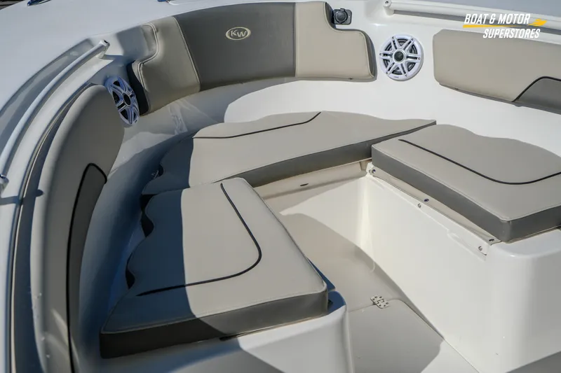 Slide: The Image of 2026 Key West 260 Center Console boat interior with cushioned seating and speakers. - 64