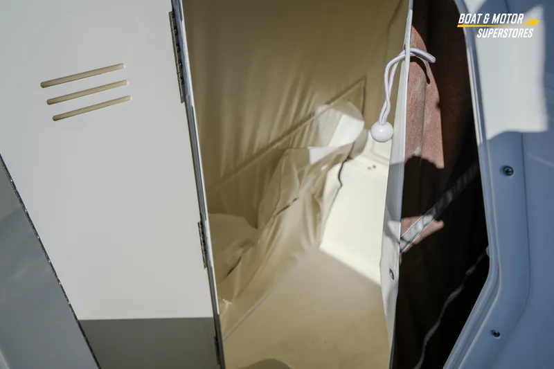 Slide: The Image of Interior view of 2026 Key West 260 Center Console boat storage compartment. - 65