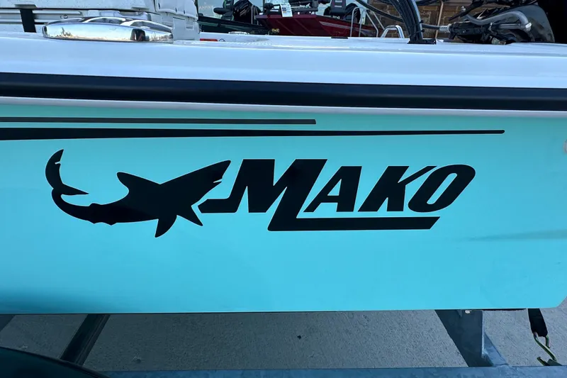 Slide: The Image of 2026 Mako Pro Skiff 15 CC boat logo on light blue hull. - 18